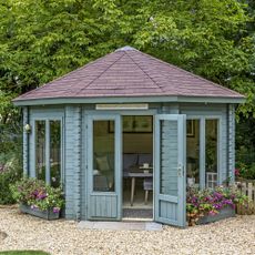 Octagonal summerhouse with tile roof in the garden