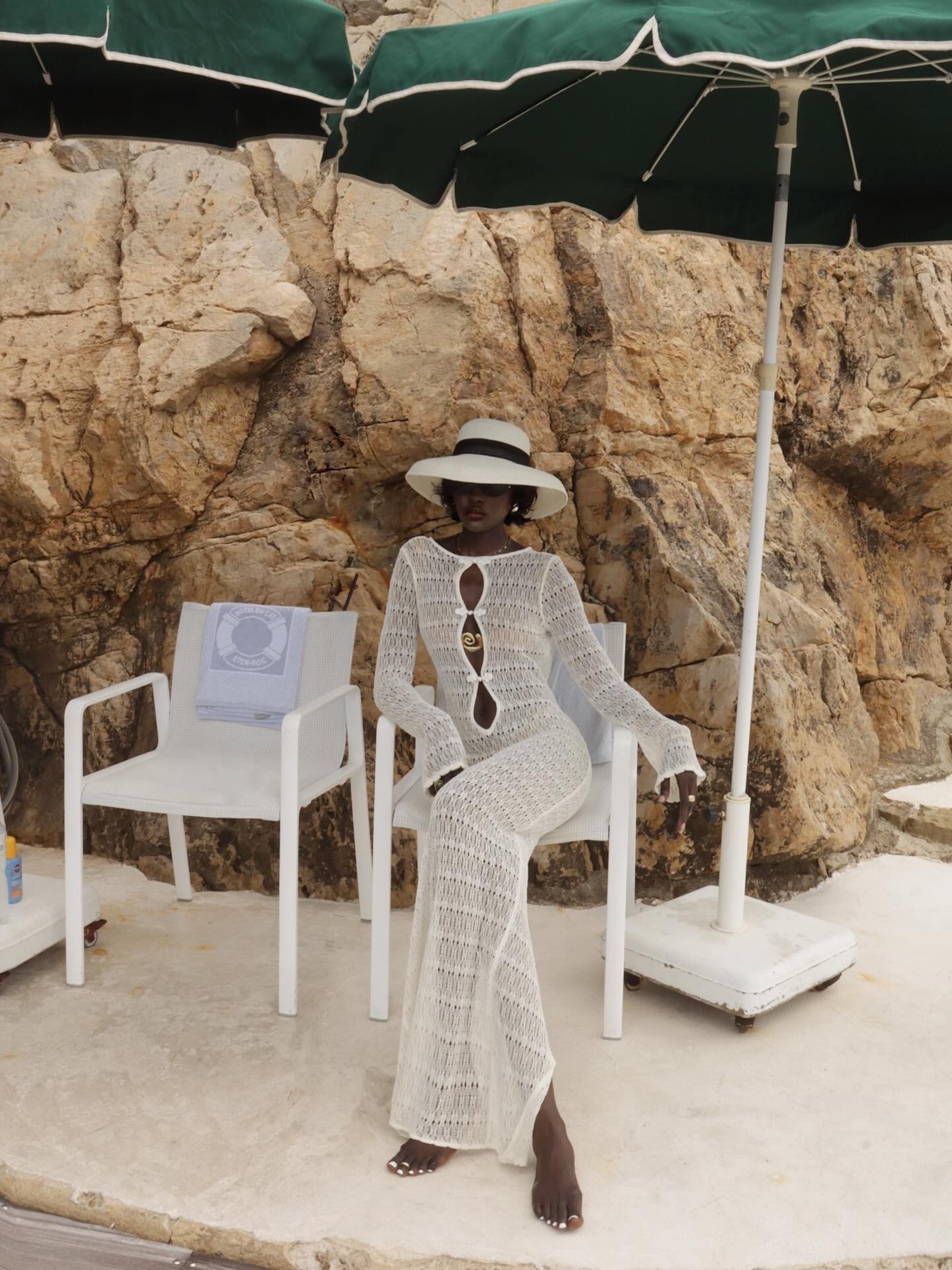 A woman in Saint-Tropez wearing a big straw hat