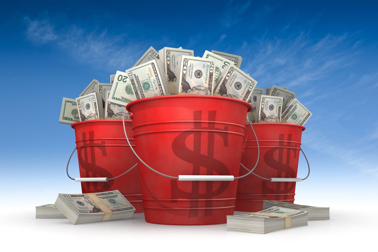 money in three red buckets with dollar signs on them