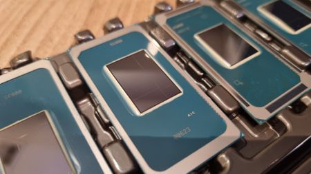 A row of Intel Core Ultra Series 3 chips on a wooden table