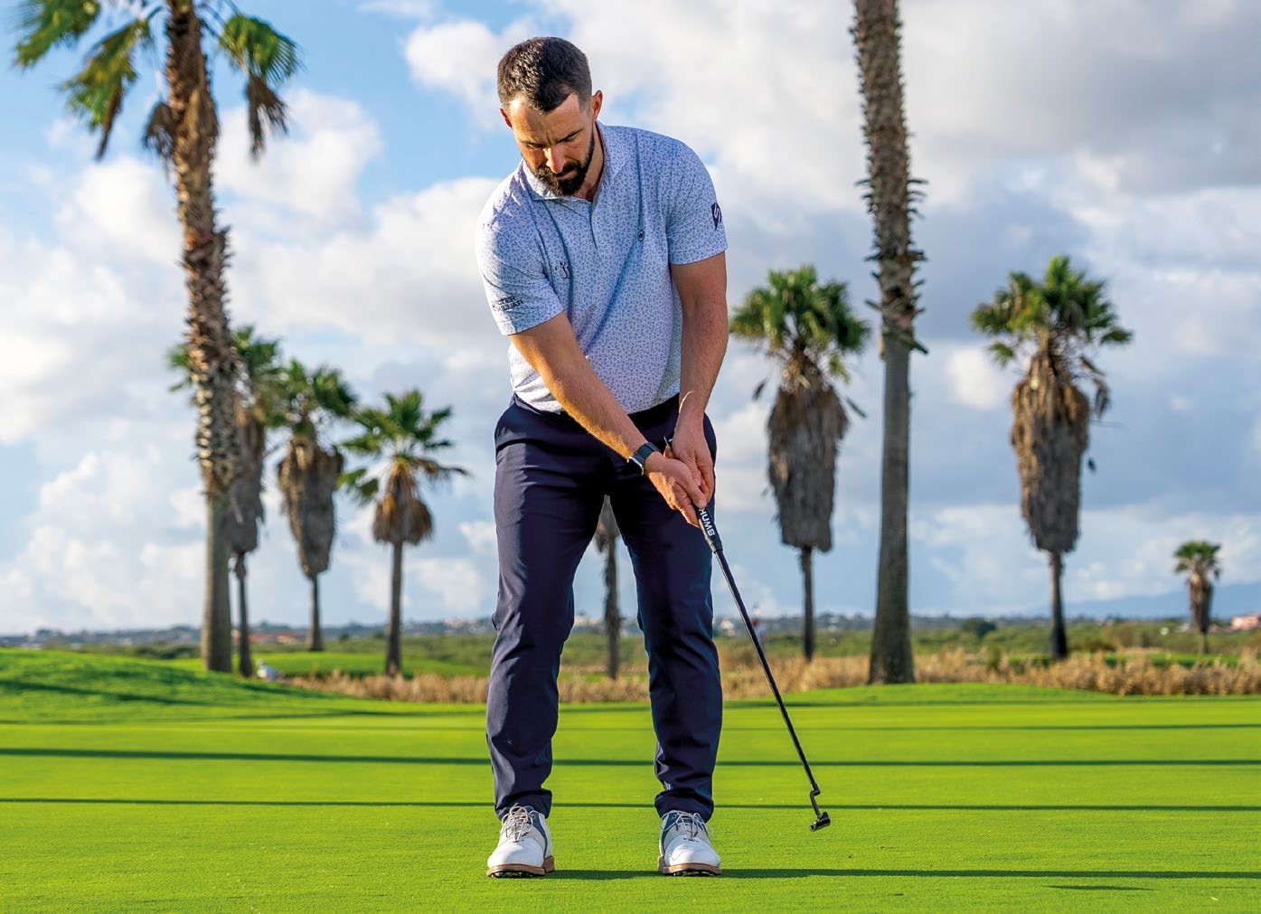 James Jankowski demonstrating the natural shoulder tilt when using the conventional grip