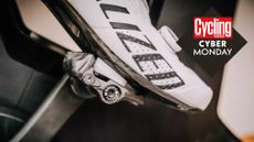 Image shows a person cycling with a powet meter pedal