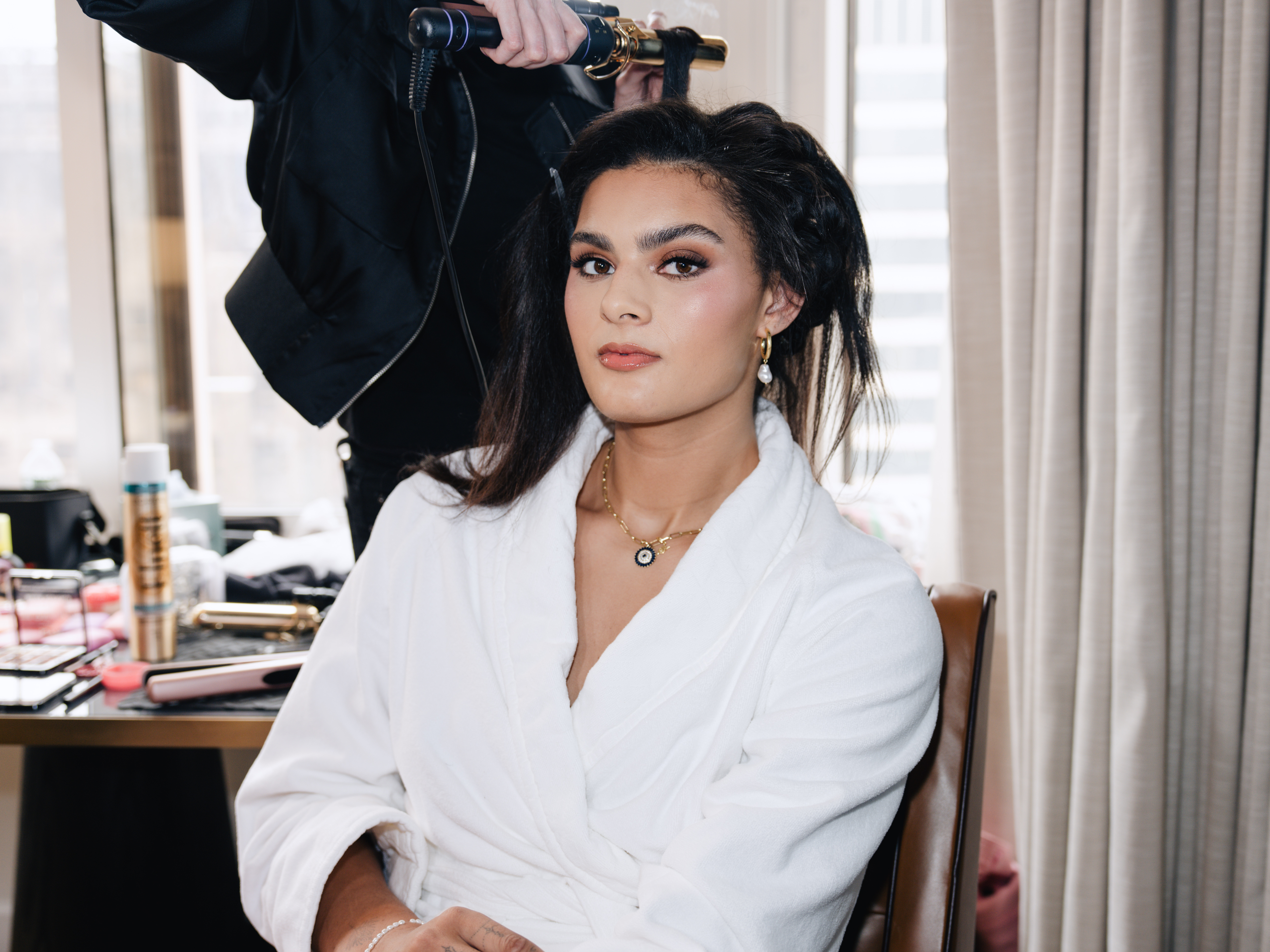 Lauren Betts gets ready for the 2026 WNBA Draft where she wore a custom Coach dress and a matching Tabby Bag