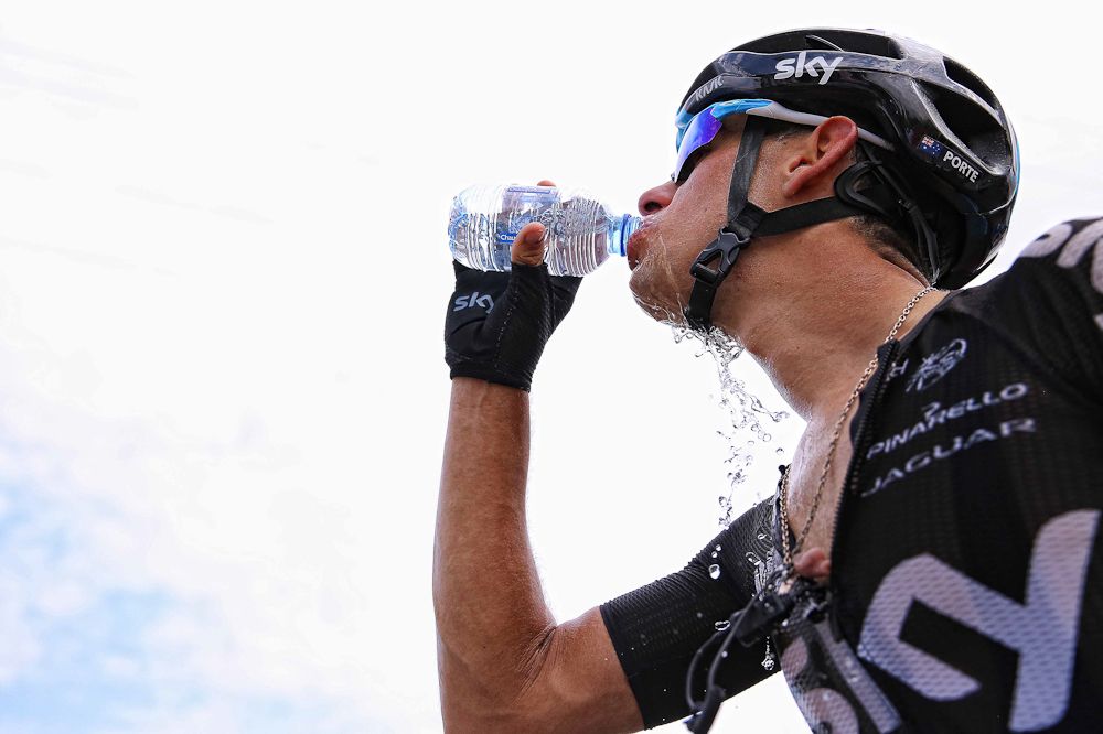Richie Porte downs some water.