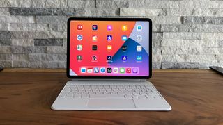 An Apple iPad Pro on a table, with a keyboard