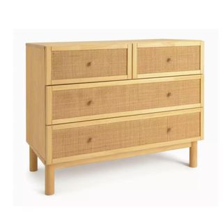 A rattan chest of drawers with two small and two large drawers