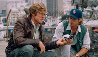 Spy Game Robert Redford and Brad Pitt staking out a target