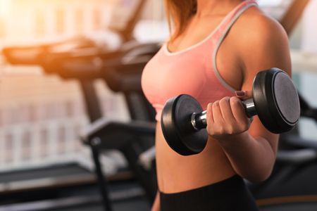 Woman working out with dumbbell