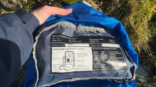 The emergency numbers and packing guide inside the The Highlander Vorlich rucksack