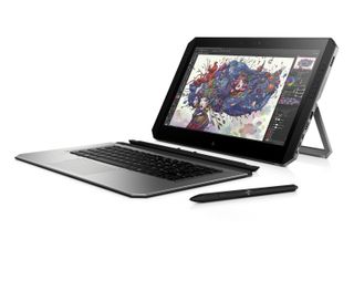 HP ZBook x2 screen raised on a stand, with detached keyboard and Wacom pen in front of it