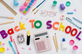 Back to school concept. Creative composition of school stationery on a white background. Top view, flat lay.