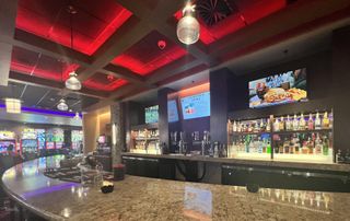 Crystal-clear audio is provided at this casino-lit bar in a bingo and gaming complex.