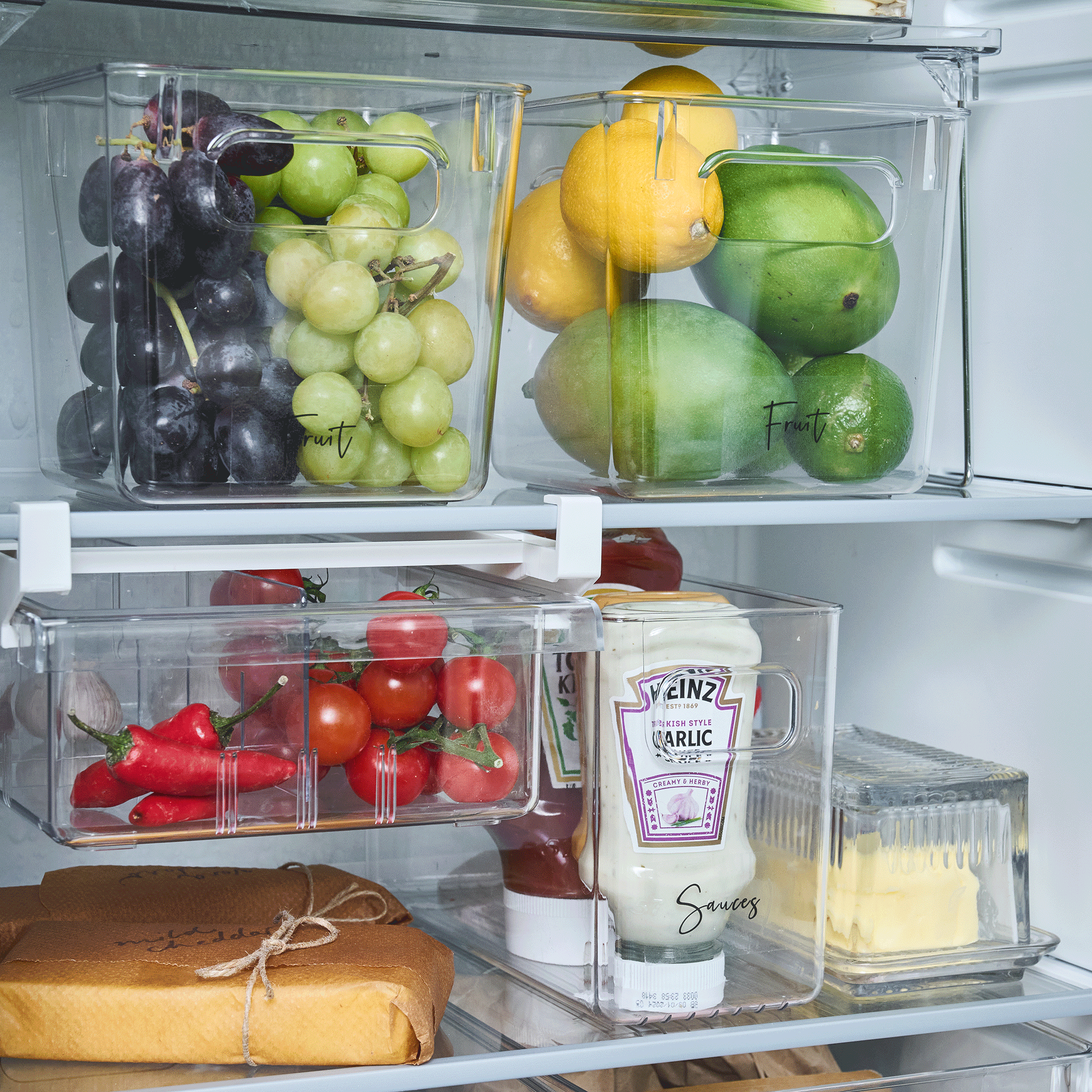 food in storage bins in fridge