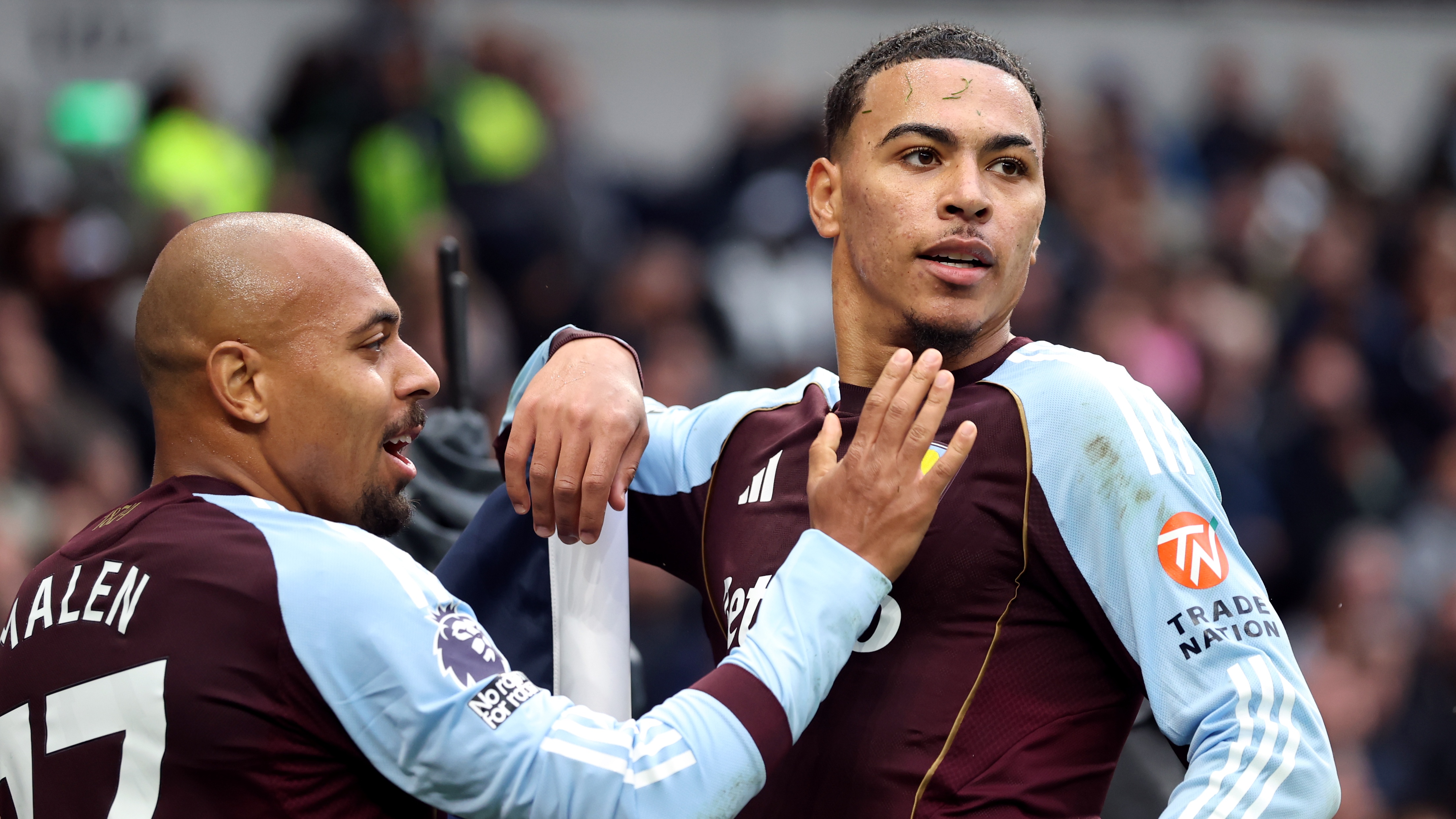 Morgan Rogers of Aston Villa celebrates scoring his team's first goal with teammate Donyell Malen during the Premier League match between Tottenham Hotspur and Aston Villa at Tottenham Hotspur Stadium on October 19, 2025 in London, England.