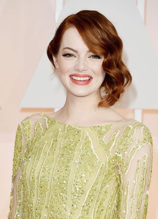 Emma Stone attends the 87th Annual Academy Awards in 2015