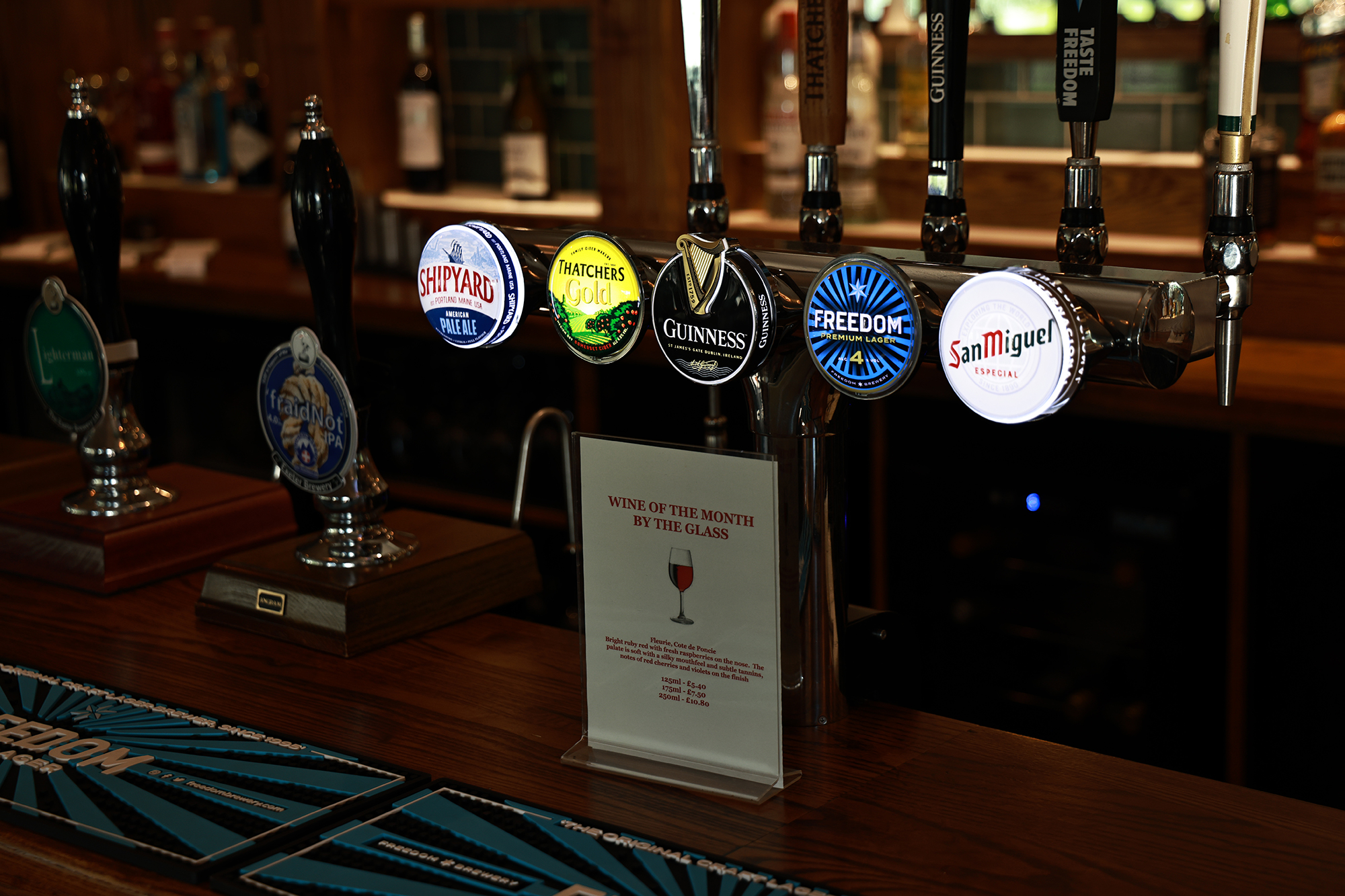 A bar with five beers on draught and two ales pumps