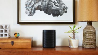 best Alexa speaker: Sonos One on side table under gray painting