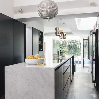 Modern kitchen with island and pendant light extractor fan