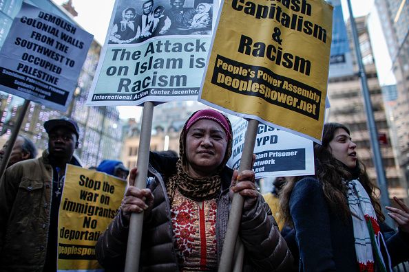 A Muslim woman protests outside Trump Tower.