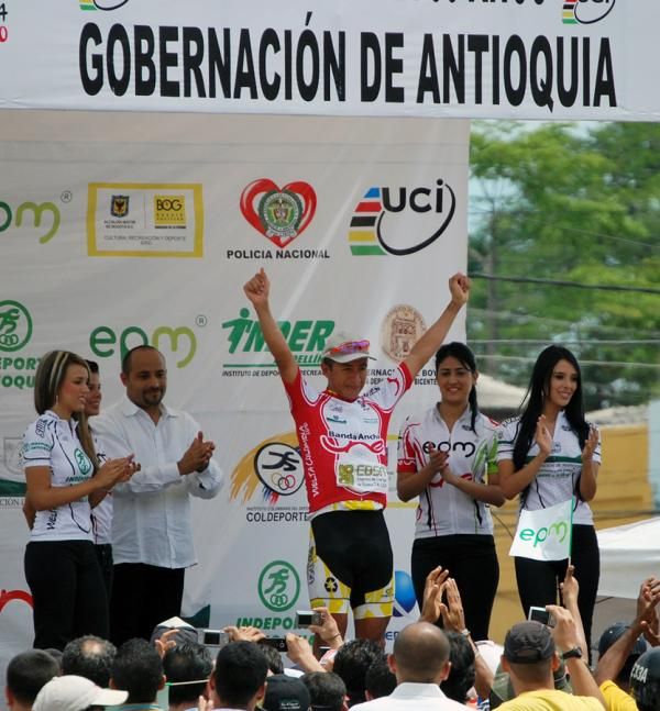 Jairo Perez celebrates on the podium as stage winner.