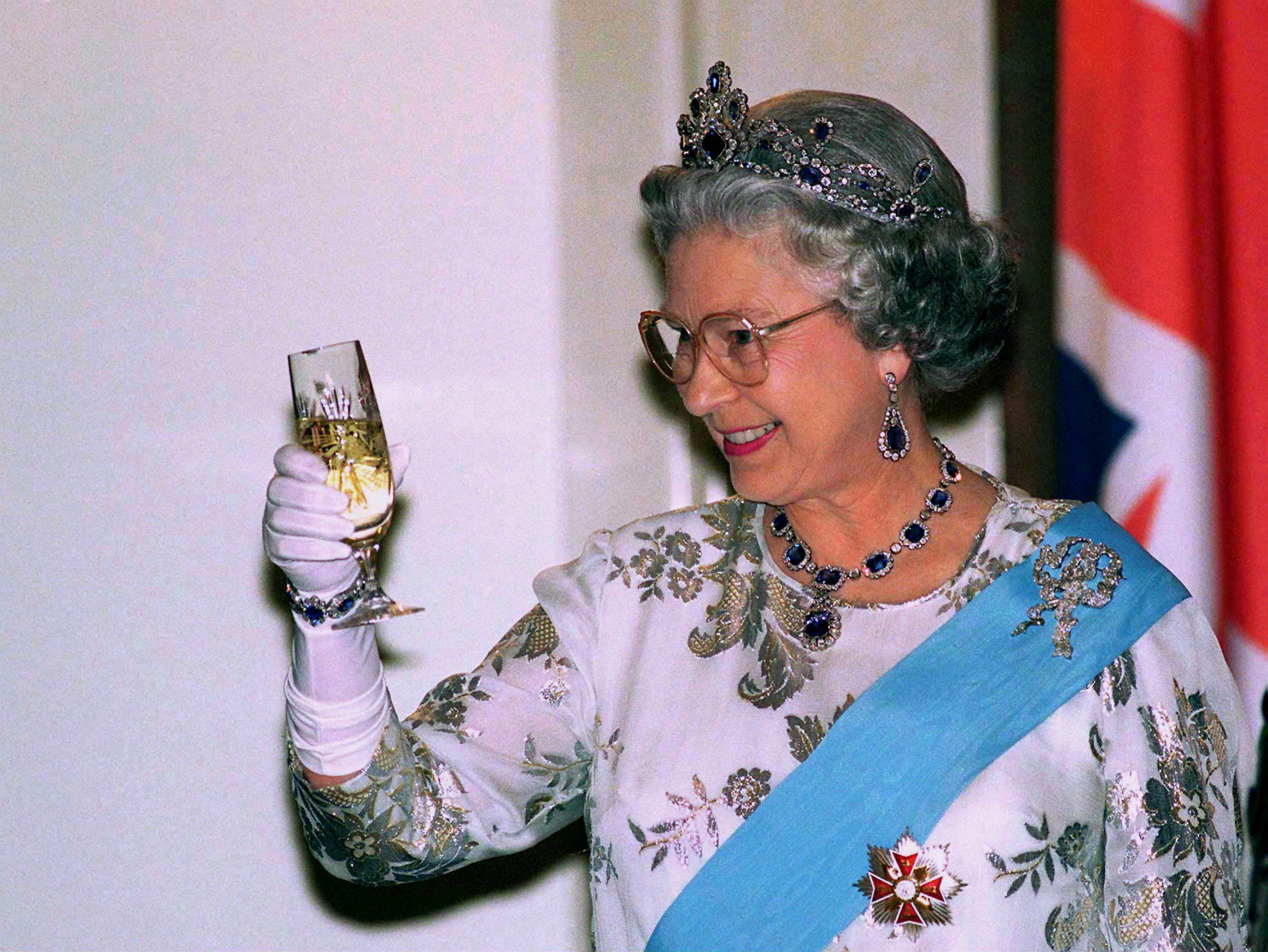 Queen Elizabeth toasting in a sapphire tiara
