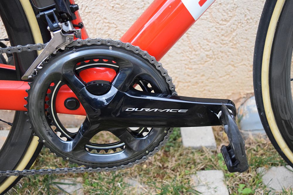 A magnetic sensor on the chain stay pairs with the Shimano power meter as a sensor