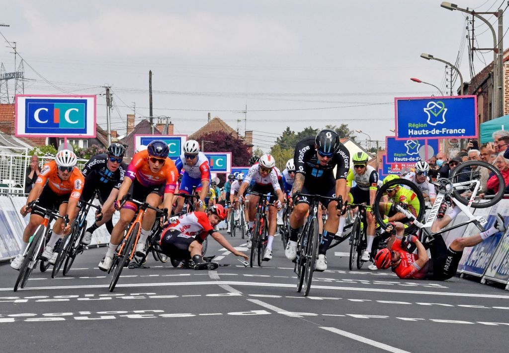 TOPSHOT Team DSMs Australian Sam Welsford C crosses the finish line next to Human Powered Healths Dutch Arvid de Kleijn 3L as Lotto Soudals Belgian Arnaud De Lie 4L and Arkea Samsics British Daniel McLay R crash during the 161 km between Dunkirk and Aniche first stage of the 4 jours de Dunkerque Four days of Dunkirk cycling race in Aniche northern France on May 3 2022 Dutch rider Arvid de Kleijn Human Powered Health was declared winner of the first stage of the Four Days of Dunkerque on May 3 2022 in Aniche after Australian rider Sam Welsford was dropped Welsford Team DSM was the first to cross the line but was considered responsible for the crash that sent Arnaud De Lie Lotto Soudal and Daniel McLay Arkea Samsic to the ground Photo by FRANCOIS LO PRESTI AFP Photo by FRANCOIS LO PRESTIAFP via Getty Images