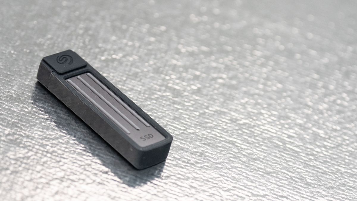 Seagate Ultra Compact SSD on a glass background.