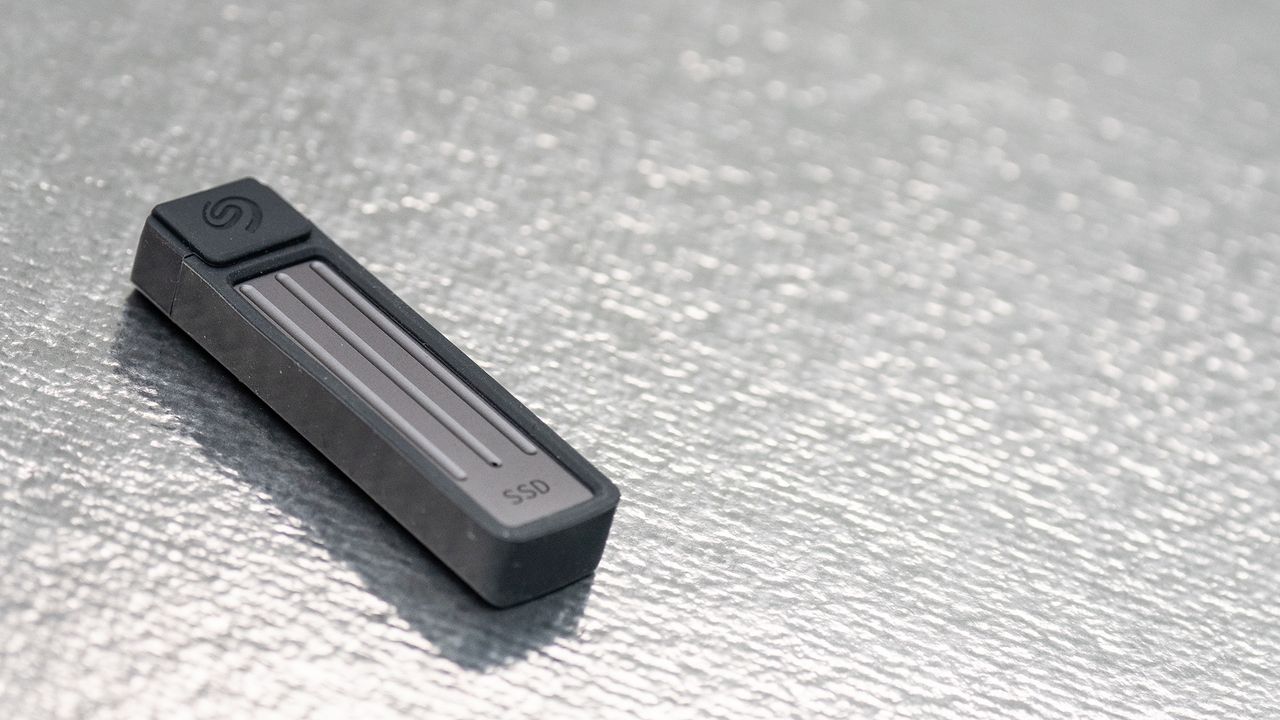 Seagate Ultra Compact SSD on a glass background.