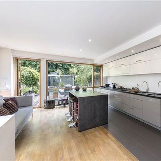 kitchen with wooden flooring and open garden
