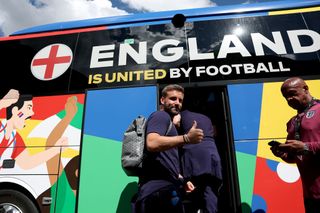 Luke Shaw of England poses for a photo as he boards the team bus as the England squad travel to Berlin ahead of the UEFA EURO 2024 final match between Spain and England at Spa & Golf Resort Weimarer Land on July 13, 2024 in Blankenhain, Germany.