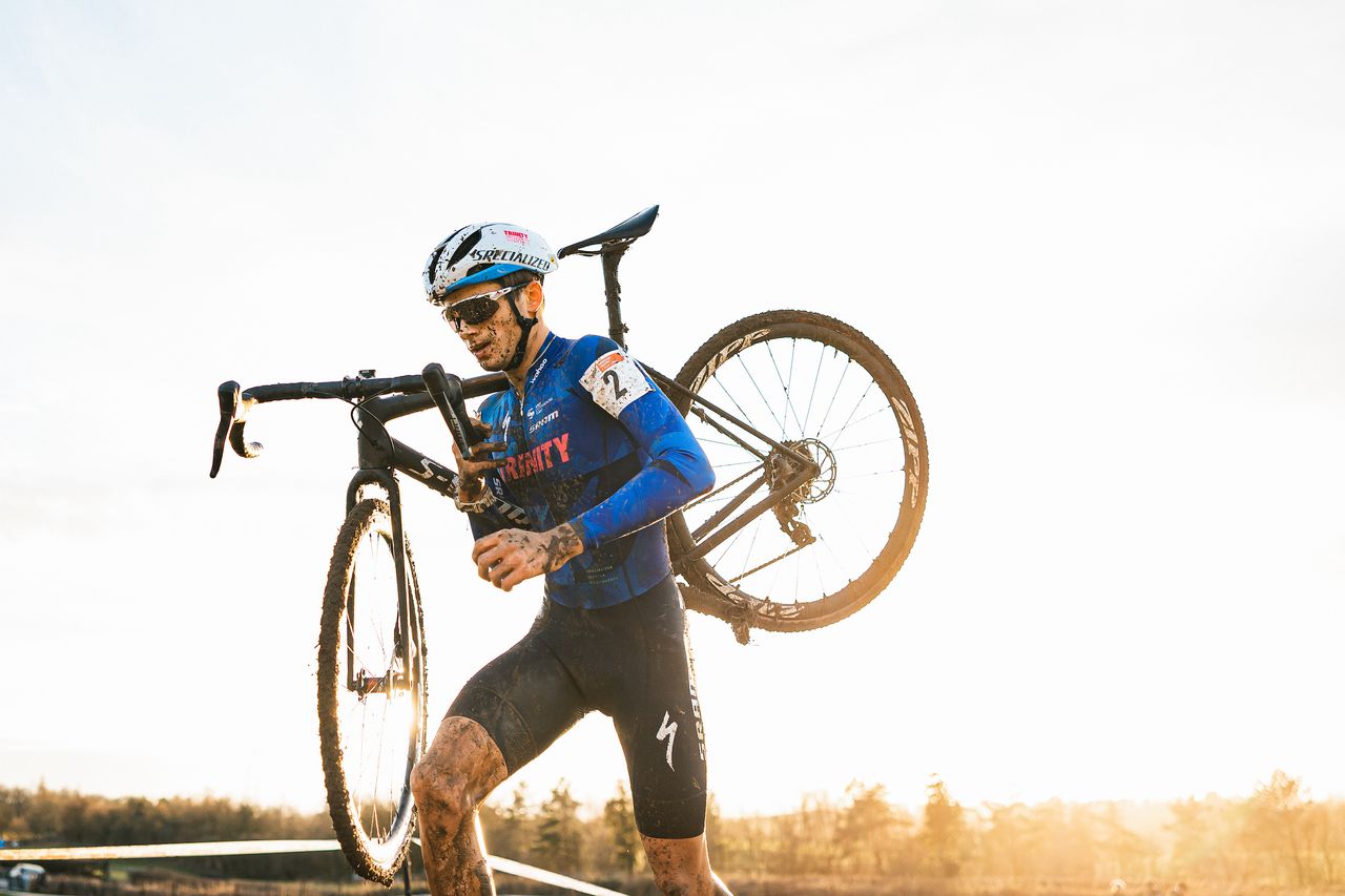 Cameron Mason carrying his bike