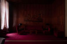 Room in deep burgundy with a sofa