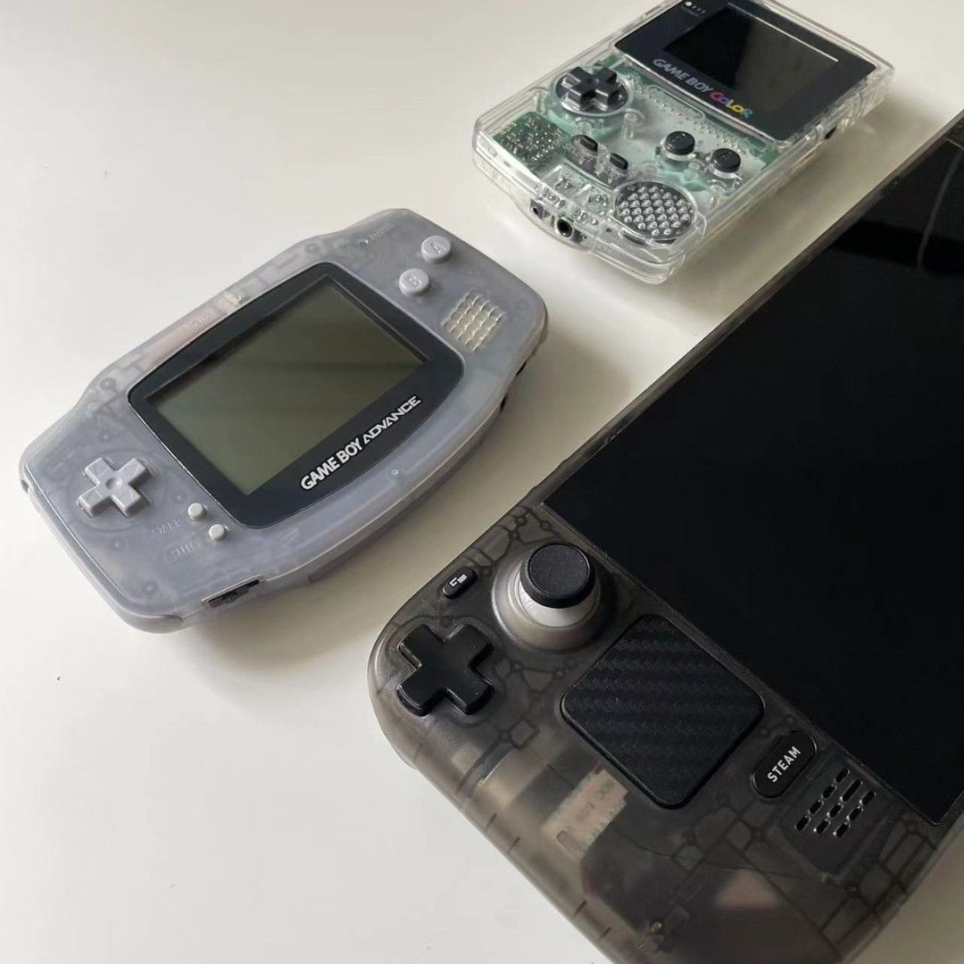 GameBoy Advance, GameBoy color, and SteamDeck, all in transparent shells