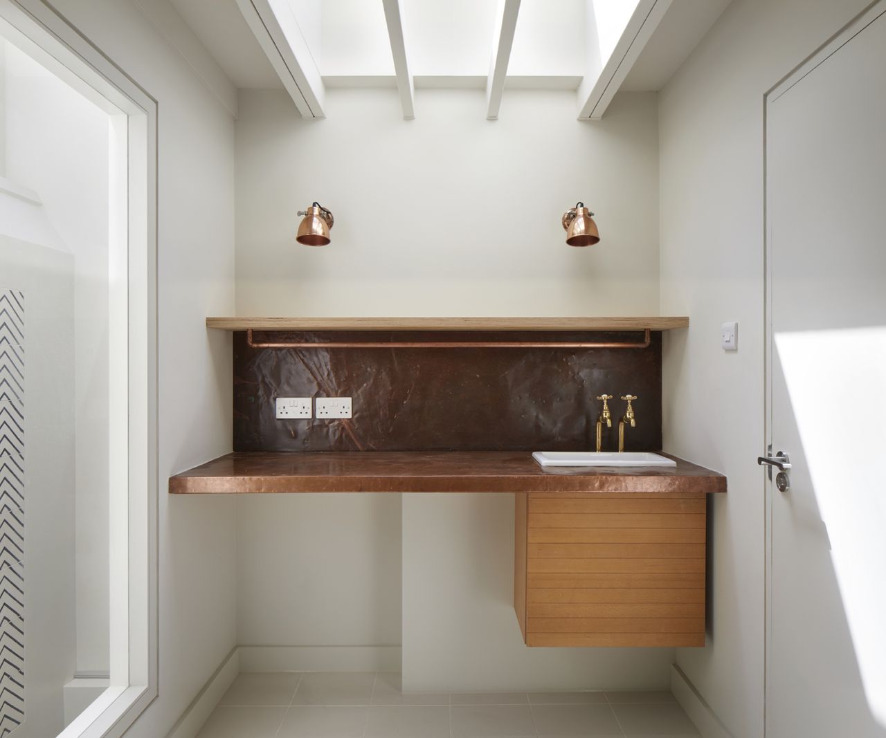 a bathroom in a narrow build