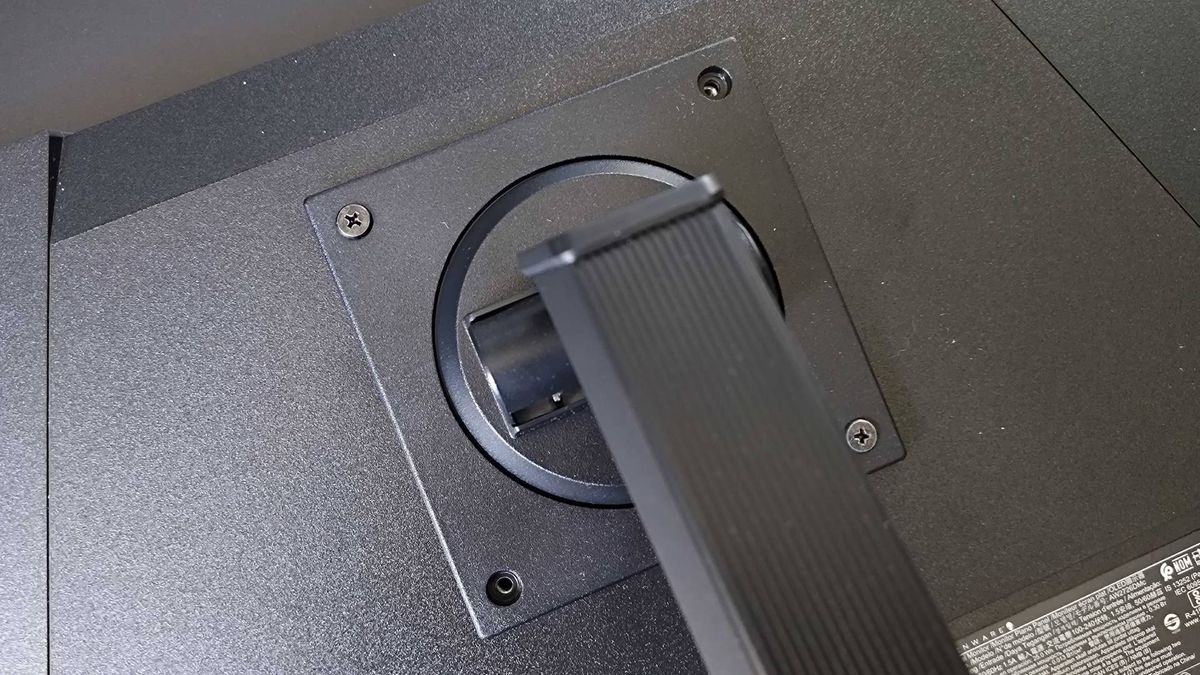 Close up of Alienware AW2726DM stand with VESA screws inserted.
