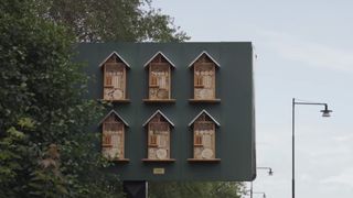 Six boutique bee huts have been added to the reverse of this billboard