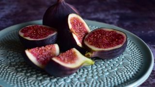 open figs on green plate