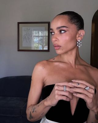 Zoë Kravitz attends the 82nd Annual Golden Globe Awards at The Beverly Hilton on January 05, 2025 in Beverly Hills, California wearing diamond earrings from her engagement ring designer jessica mccormack