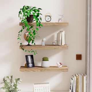 wyewye Wooden Floating Shelves Set of 3 on a living room wall