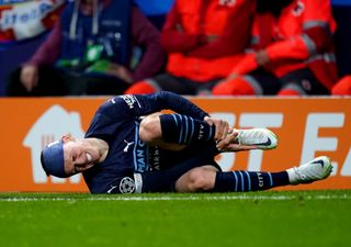 Manchester City forward Phil Foden goes down injured