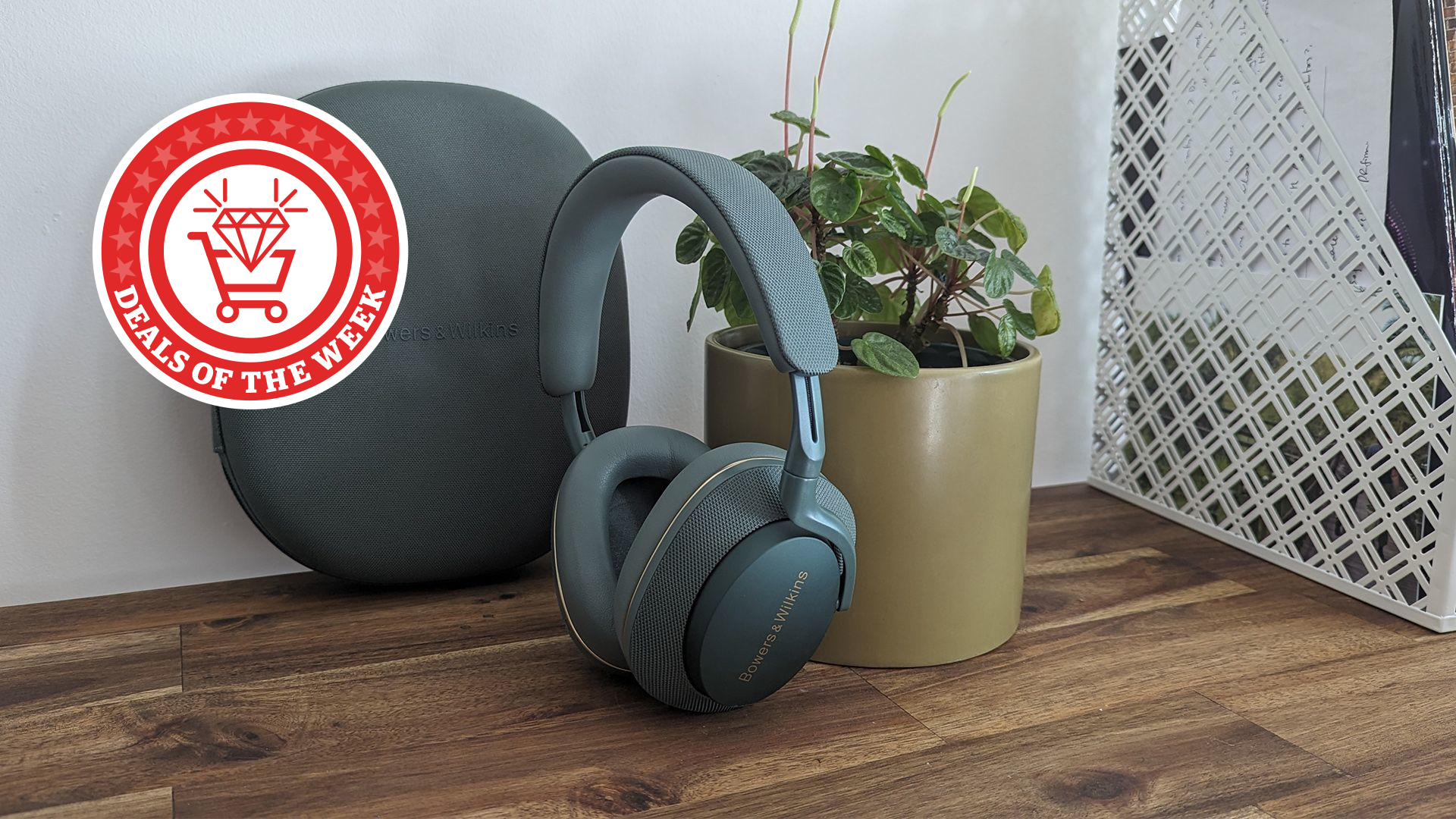 B&W headphones on desk with Deals of the Week logo