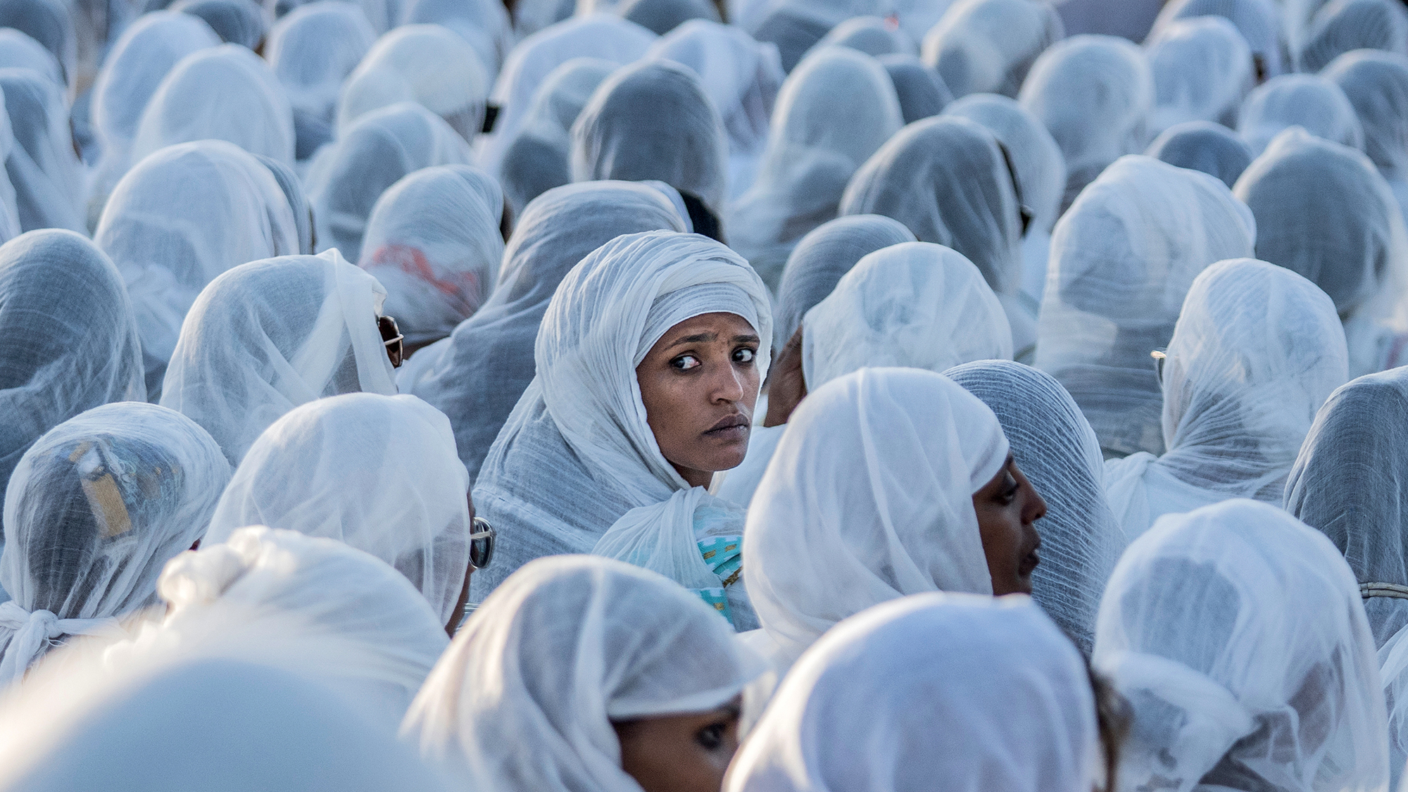 Ethiopian Orthodox devotees gather on Christmas Eve (in accordance with the Julian calendar) at Meskel Square in Addis Ababa, Ethiopia