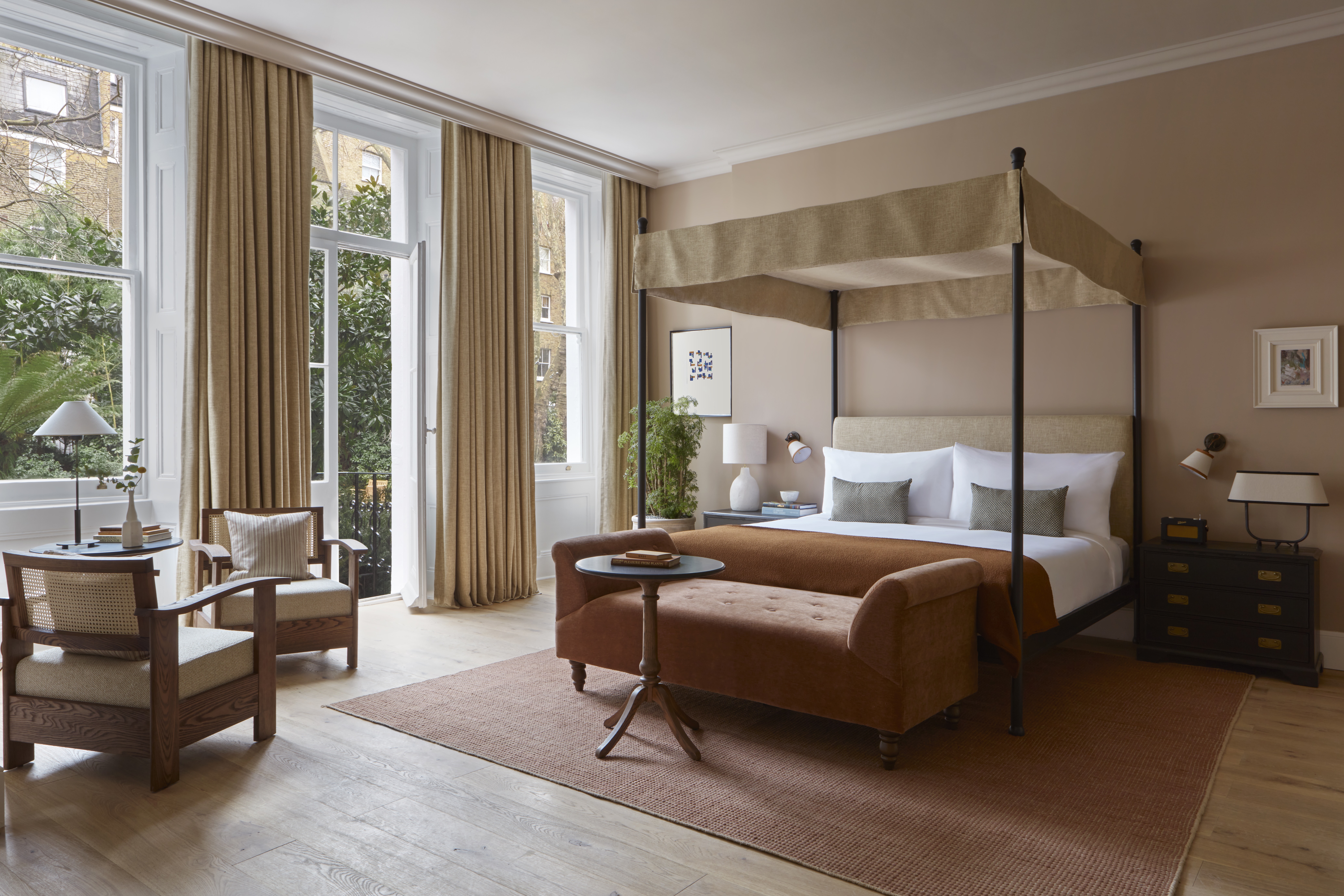 Hotel bedroom in soft pink tones