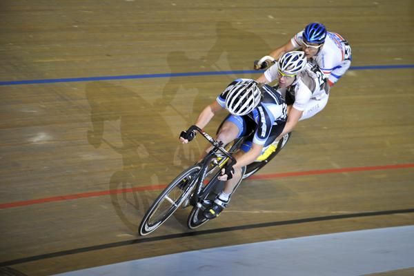 A trio of riders are shadowed around the Darebin International Sports Centre.