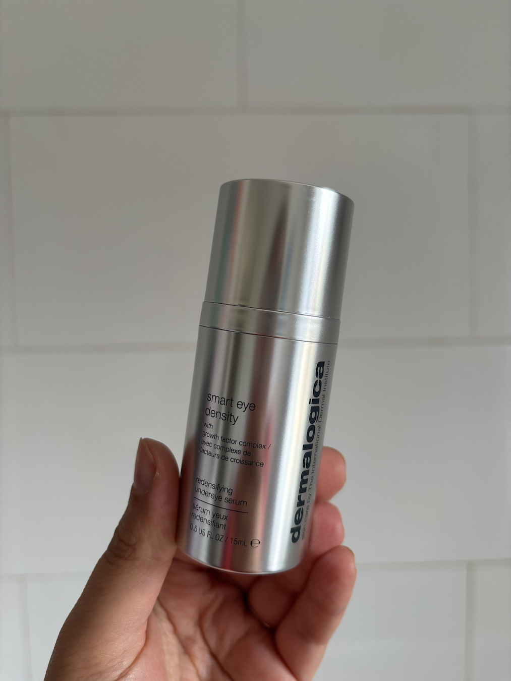 Mica Ricketts holding Dermalogica Smart Eye Density Redensifying Undereye Serum