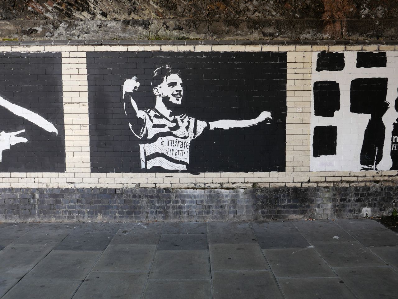 Artwork of soccer player Declan Rice outside Arsenal's stadium