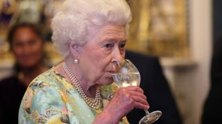 Queen sipping gin