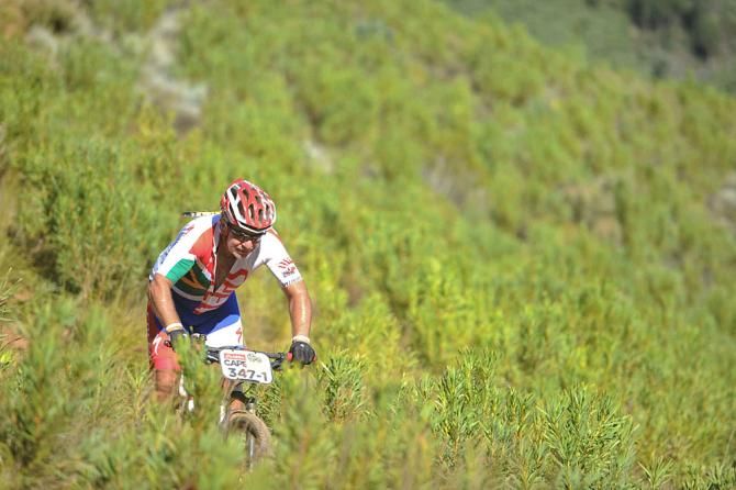 Charles Stander, father of the late Burry Stander rides through the fynbos