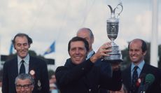 Gary Player hoists the Claret Jug in the air